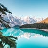 Idyllic view of Moraine Lake reflecting mountains and forests in Banff National Park, Canada.